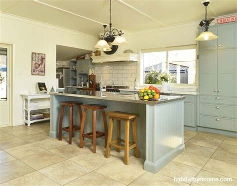 In general, selecting a neutral paint color can be challenging. The kitchen cabinets are painted in the soft grey-green ...