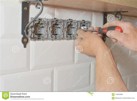 Electrician Installing Wall Socket Stock Photo - Image of background ...