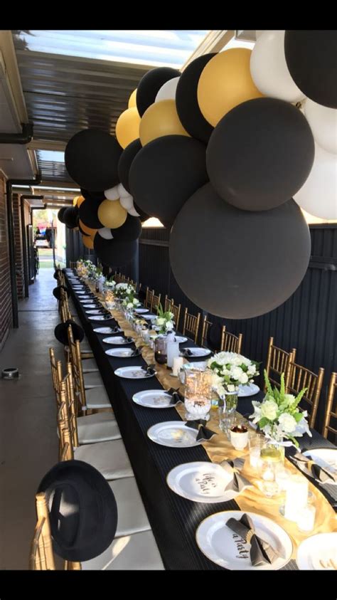 50th long table setting! Black, gold and white. | Birthday table