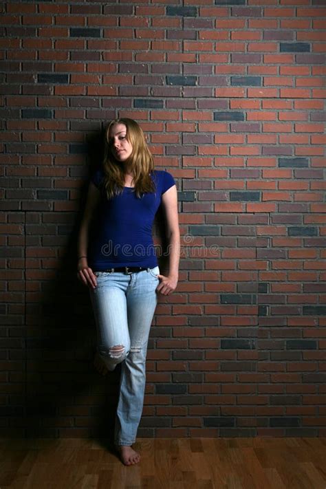 Woman Leaning Against Brick Wall Stock Image Image 5937871