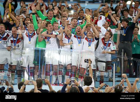 Germanys Philipp Lahm Lifts The World Cup Trophy As He Celebrates