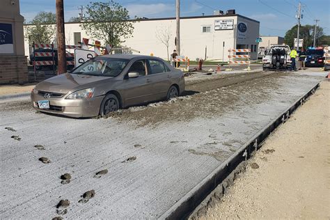 Woman Tries To Flee Police Drives Into Wet Concrete And Gets Stuck