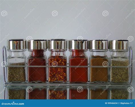Jars Of Herbs And Spices In Spice Rack Stock Photo Image Of Orange