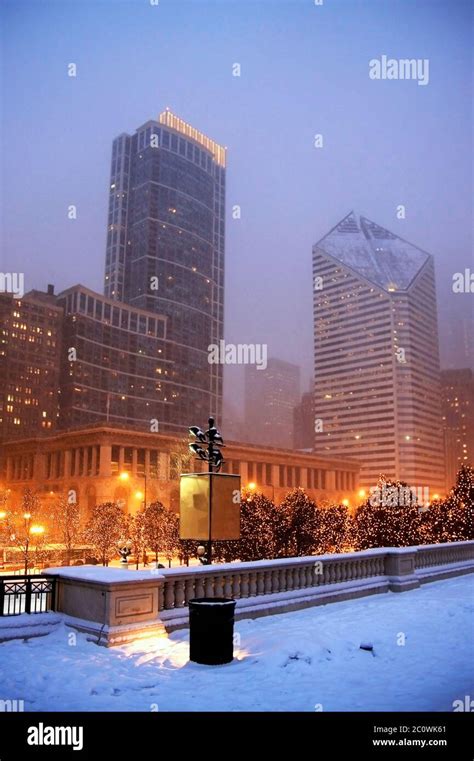 Cityscape With Snowfall And Street Lights In The Center Of Chicago