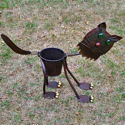 Bring the outside in your apartment with pots and planting essentials at urban outfitters. Metal Springy Cat Garden Planter Ornament