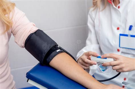 Doctor Checking Blood Pressure Stock Image Image Of Caucasian