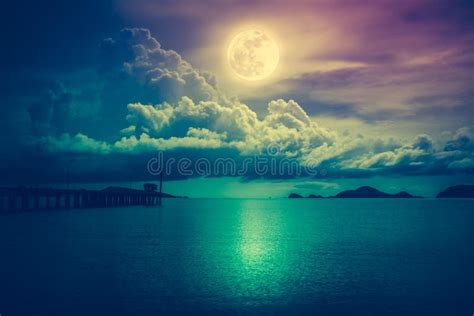 Landscape Of Sky With Full Moon On Seascape To Night Cross Process