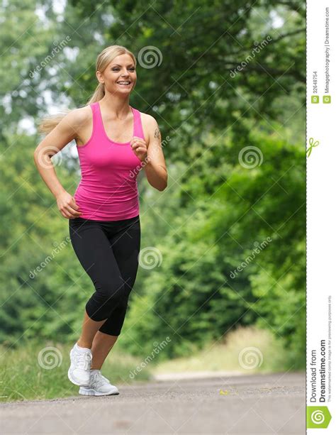 Happy Young Woman Jogging Outdoors Stock Images Image