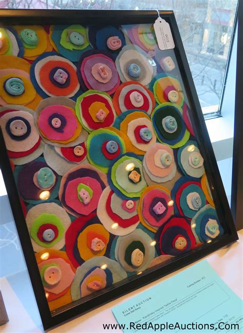 school auction class project collage made of felt circles with a button on top to sew the whole