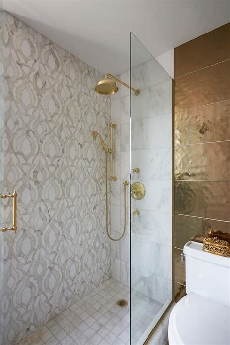 mixed shower wall tiles feature gold and gray mosaic tiles displaying a stunning design