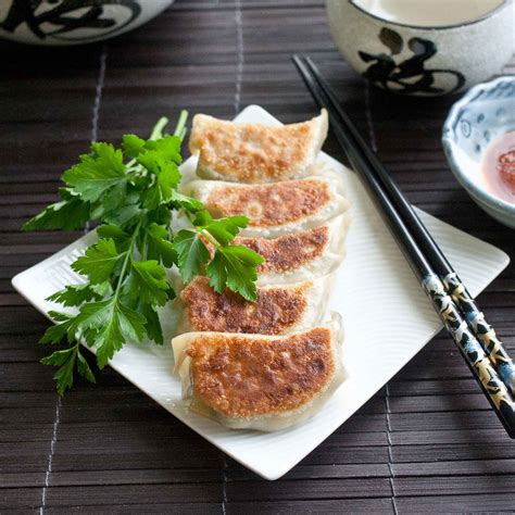 Groups of people visit the izakaya to enjoy dumplings with a drink. FOODjimoto: Gyoza - Japanese Dumplings