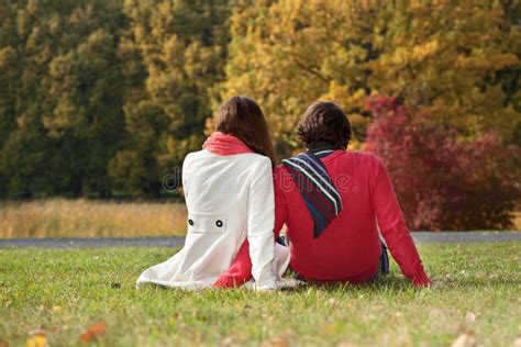 Couple Sitting On The Ground In The Park Stock Image Image Of Hugging