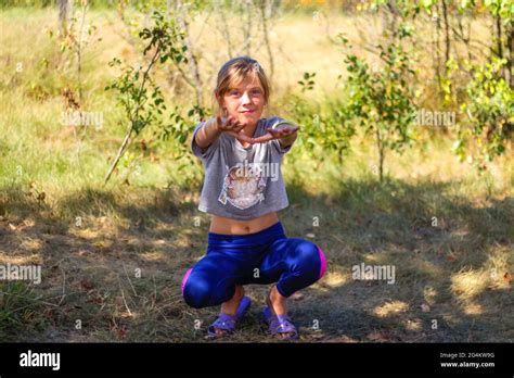 Defocus Caucasian Preteen Girl Doing Physical Exercise In Park Forest Outdoor Outside