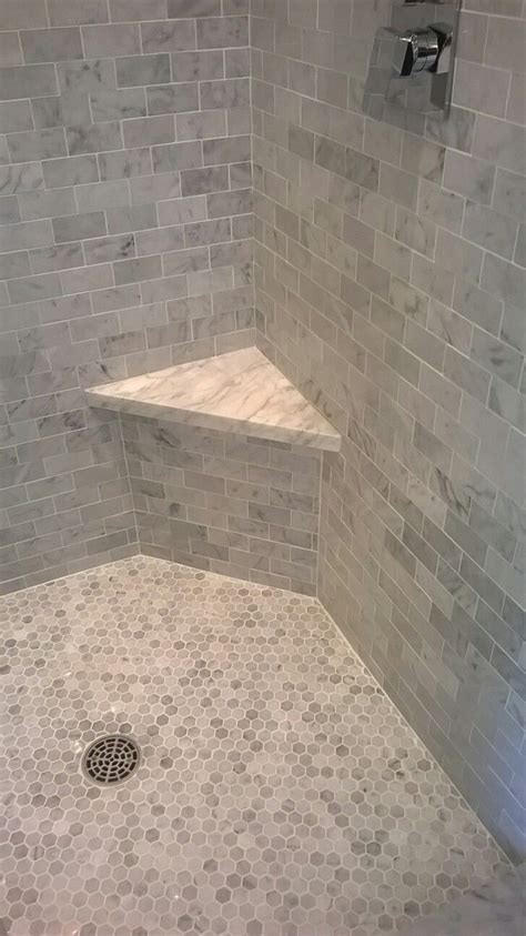 A corner shower bench is a great idea. Beautiful marble shower with corner bench. www.floortxkaty ...