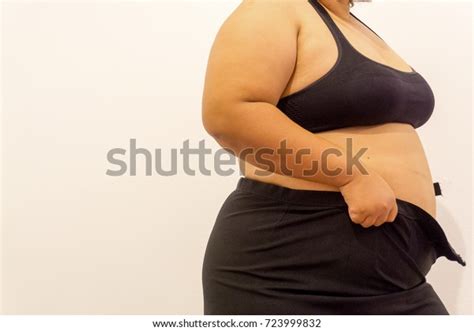 Overweight Woman Trying Fasten Her Skirt Stock Photo 723999832