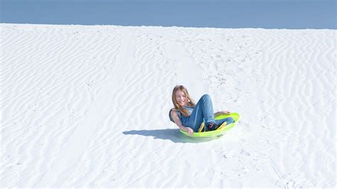 Sledding At White Sands National Park In New Mexico