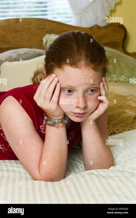 Preteen Redhead Girl In Connecticut Usa Reclining On Her Mother´s