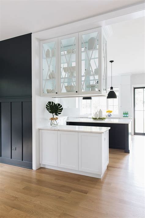 Large wall mount upper cabinets with glass doors. The upper cabinets feature glass doors on both sides ...