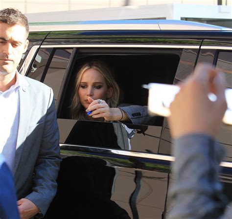 Jennifer Lawrence Signs Autographs For Fans From Her Car At The
