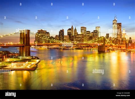 New York City Skyline Over The East River And Brooklyn Bridge Stock