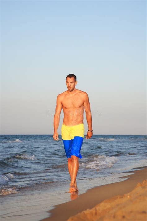 Portrait Of A Young Man Walking By The Sea Stock Image Image Of Sandy