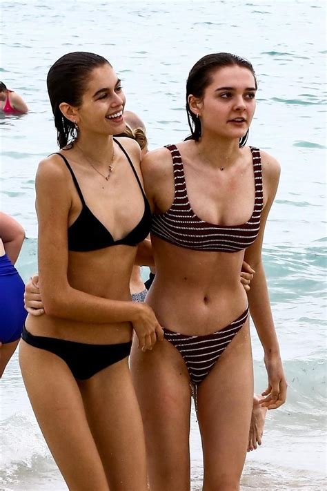 Kaia Gerber Shows Off Her Model Figure In A Skimpy Black Bikini On The Beach With Friends In