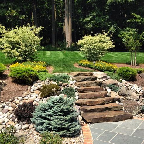 Natural Stone Steps Mixed With Boulders Leading Up From Bluestone Patio