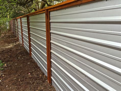 A Galvanized Corrugated Metal Fence Creates A Clean Modern Edge To The