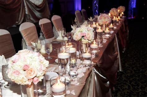 Don't forget to think on how to create a cascading wedding bouquet if you want to make the bride. Head Table with assorted cylinders with water and floating ...