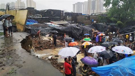 Heavy Rains Pound Indias Mumbai Disrupting Rail Air Traffic India