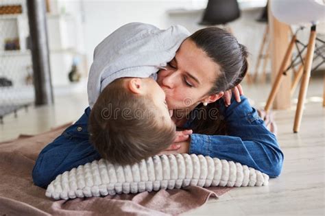 Mom And Son Cuddle Together On A Pillow Stock Image Image Of People