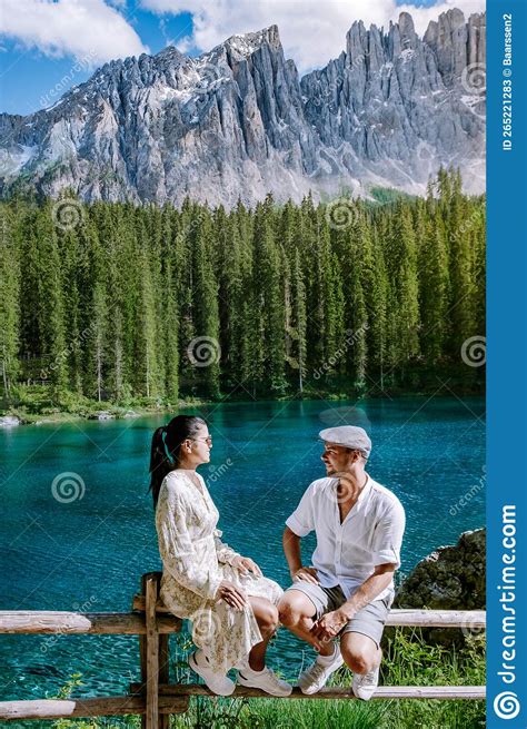 Couple Visit A Bleu Lake In The Dolomites Italy Carezza Lake Lago Di