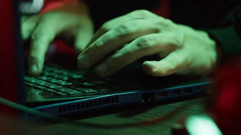 Professional Hacker Typing On Keyboard At Night Close Up Of Man Hands