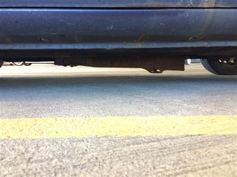Metal bar hanging under car. What is this metal thing hanging under my car ...