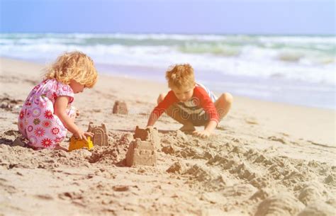 Kids Play With Sand On Summer Beach Stock Image Image Of Playful