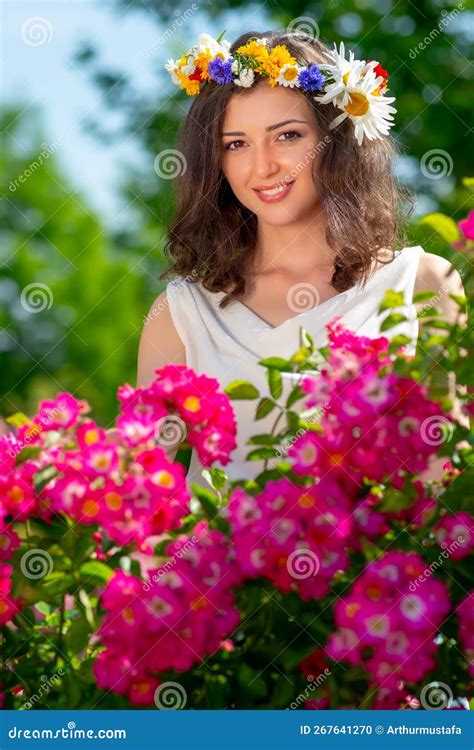 Spring Fantasy Woman Enjoys Posing Near Blooming Pink Roses Outdoor