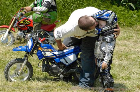 Contestants Of All Ages Compete In A Motorcycle Hill Climb Race Tingler