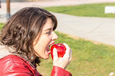 Woman Biting An Apple People Photos Creative Market