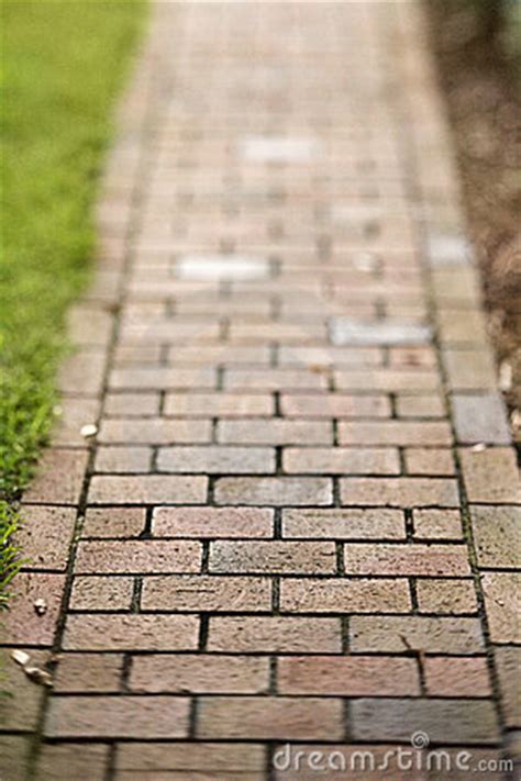Two diagonal bricks laid side by side, and the next set of two is laid vertically, and repeated until the surface is completed creating a basketweave. Red Brick Walkway Royalty Free Stock Photography - Image ...