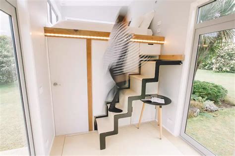 A Tiny House On Wheels With Retractable Stairs And Other Cool Features