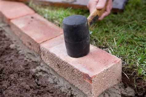 How To Edge A Lawn With Bricks Bbc Gardeners World Magazine