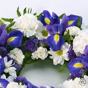 Unique themed funeral flower displays. Blue and White Wreath - Funeral Flowers London