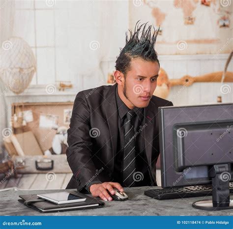 Close Up Of Office Punk Worker Wearing A Suit With A Crest Working In