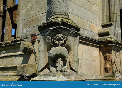 Grotesque Gargoyle Water Spout Sculpture On Facade Of Gothic Medieval