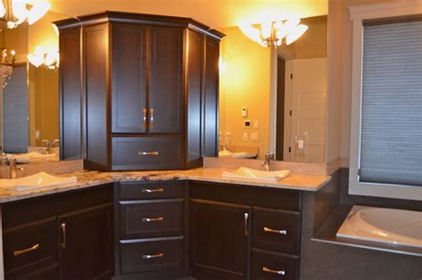 The tall linen cabinet houses extra towels, bulk beauty products and other overflow items. New Custom Maple Cabinets...dark stain - Traditional ...