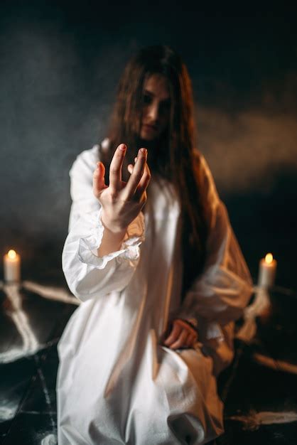 Premium Photo Witch In White Shirt Calls Upon The Spirits Pentagram