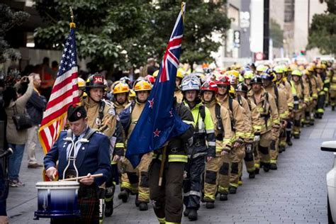 New Zealand And New York Firefighters Walk Up Sky Tower To Mark 16th