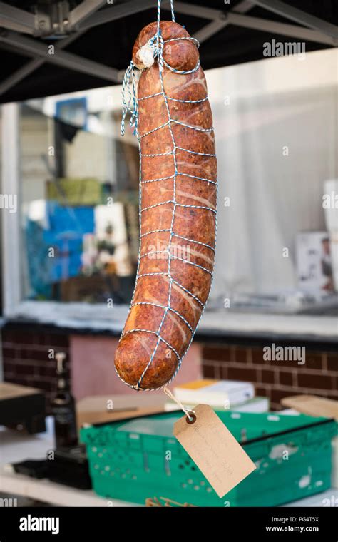 Large Sausage Hanging On A Food Stall In A British Street Market Stock
