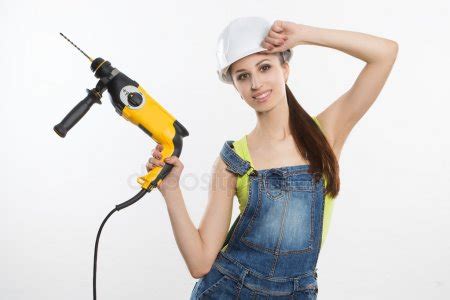 Sexy Builder Woman With A Drill In Her Hands Stock Photo By Kopitin