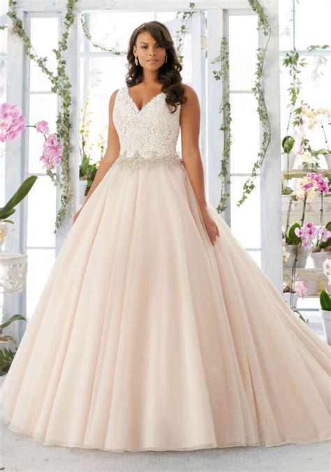 Most brides like to wear maxi wedding dresses, but tea length wedding dresses are also good choices, short wedding dresses are very cute and wedding dresses with long sleeves make you elegant. Morilee Bridal Embroidered Lace Bodice Edged with Beading ...